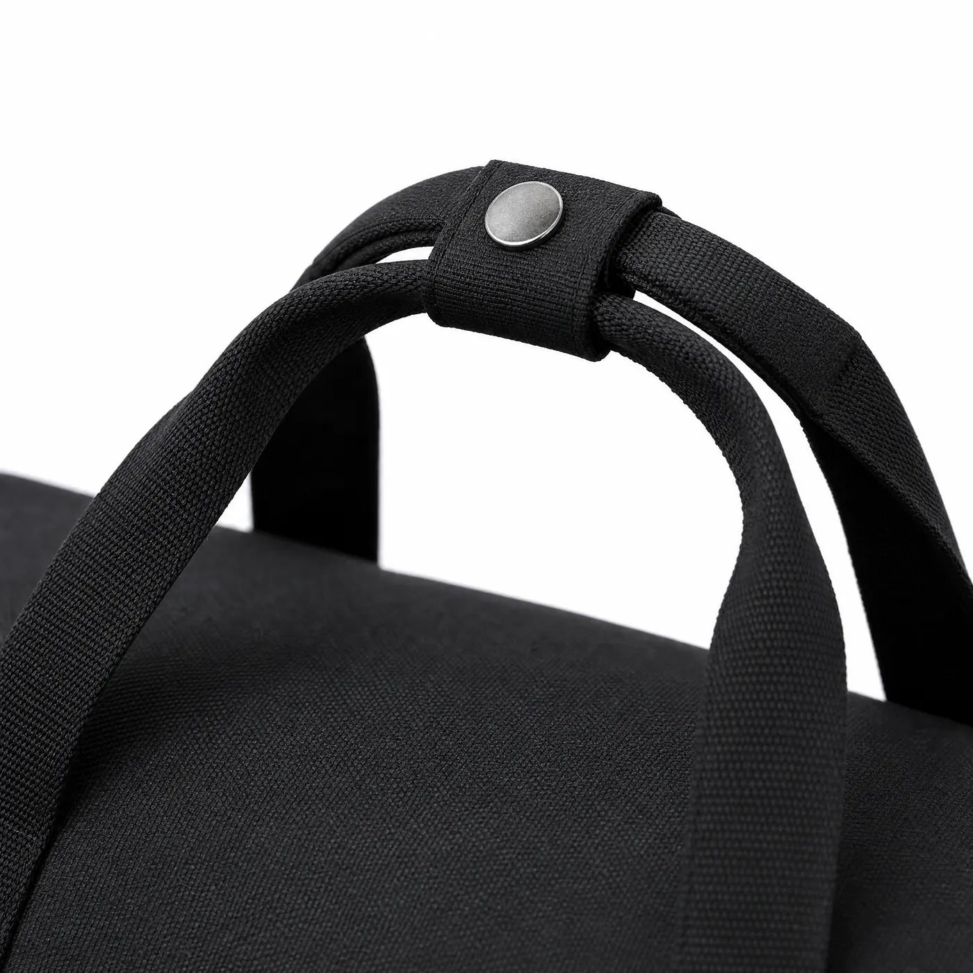 Close view of the padded snap wrap around the two carry handles