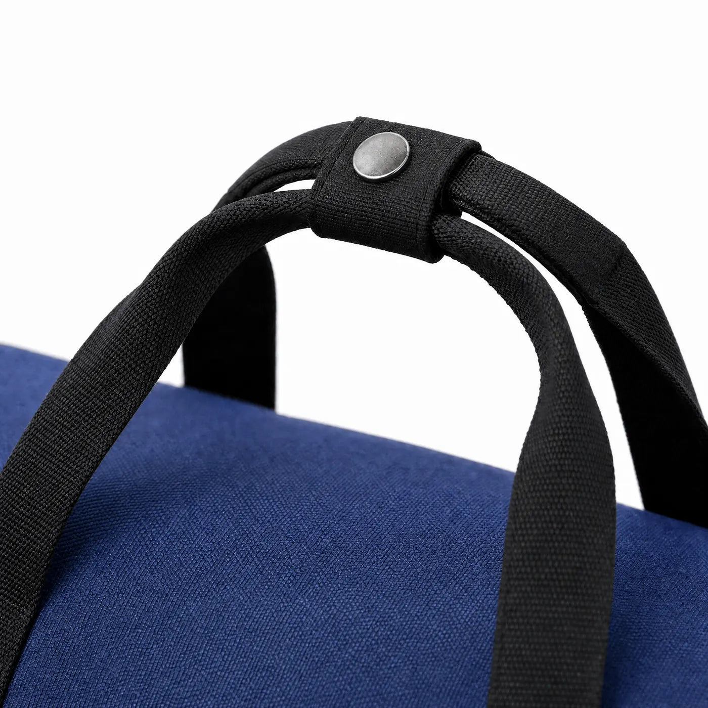 Close view of the padded snap wrap around the two carry handles