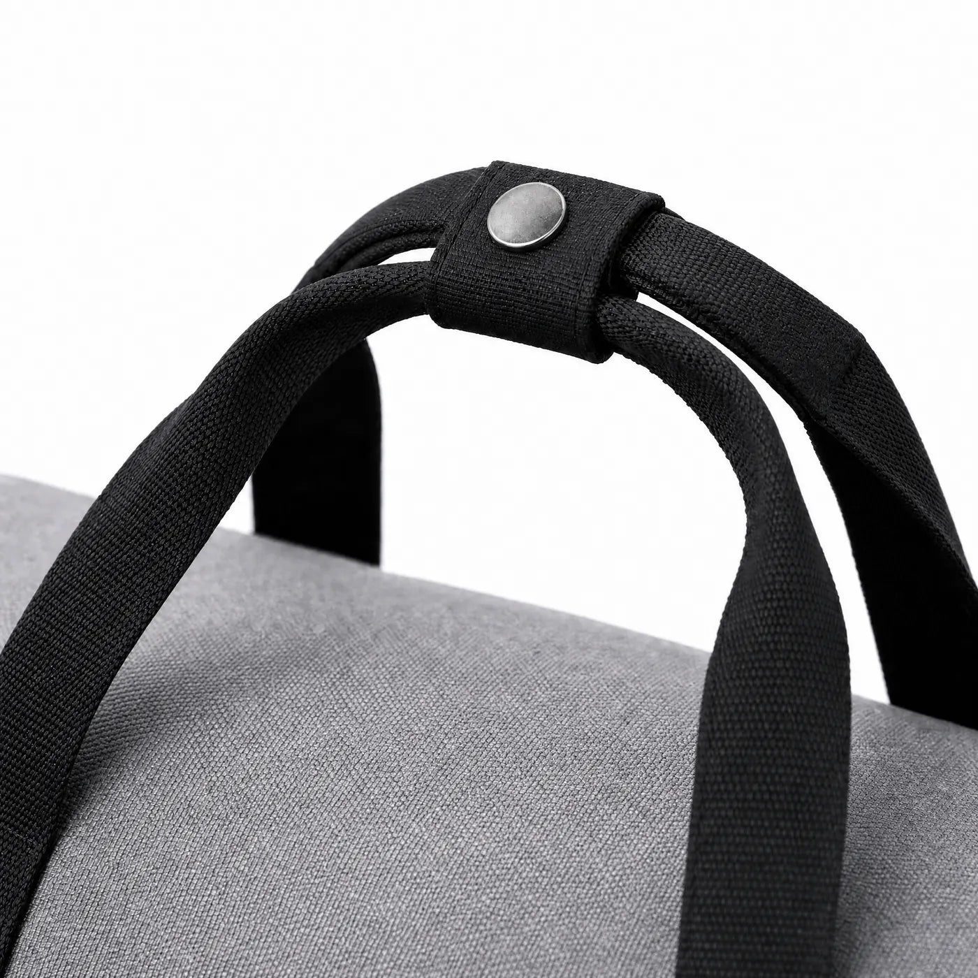 Close view of the padded snap wrap around the two carry handles