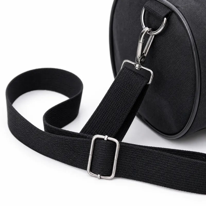 Close view of the adjustable shoulder strap with its metal slider